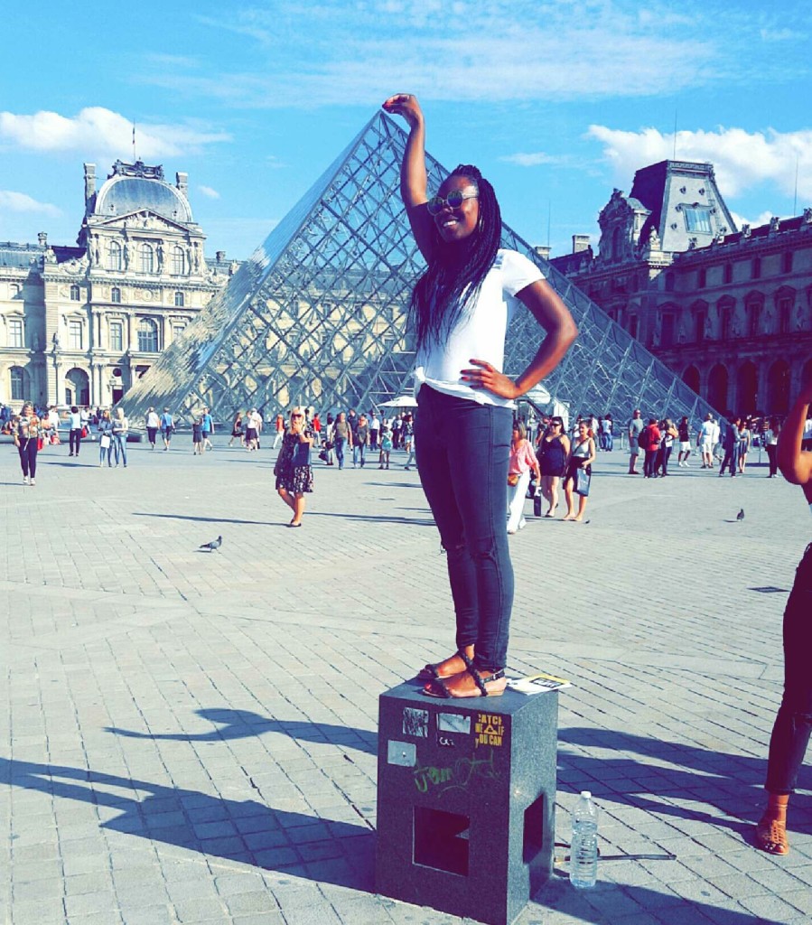 Month 8. Simone at the Louvre Pyramid in Paris. 